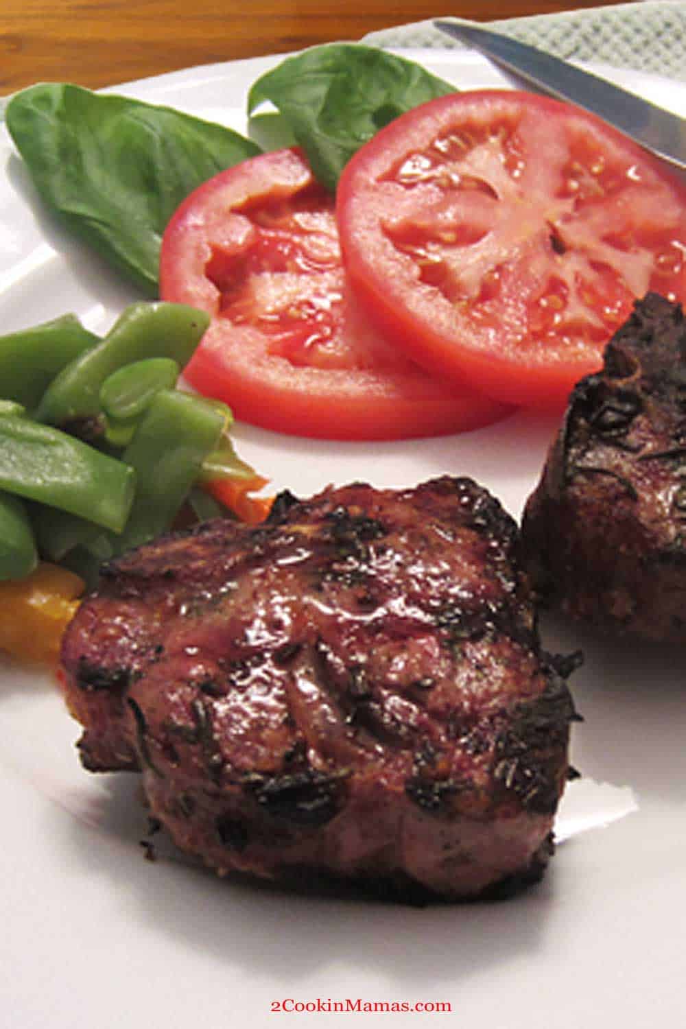 These tasty grilled lamb chops, seasoned with rosemary and basil, are an easy dinner with little cleanup. Just marinate, pop on the grill for 10 & dinner is served! #dinner #easy #recipe #grilled #lambchops