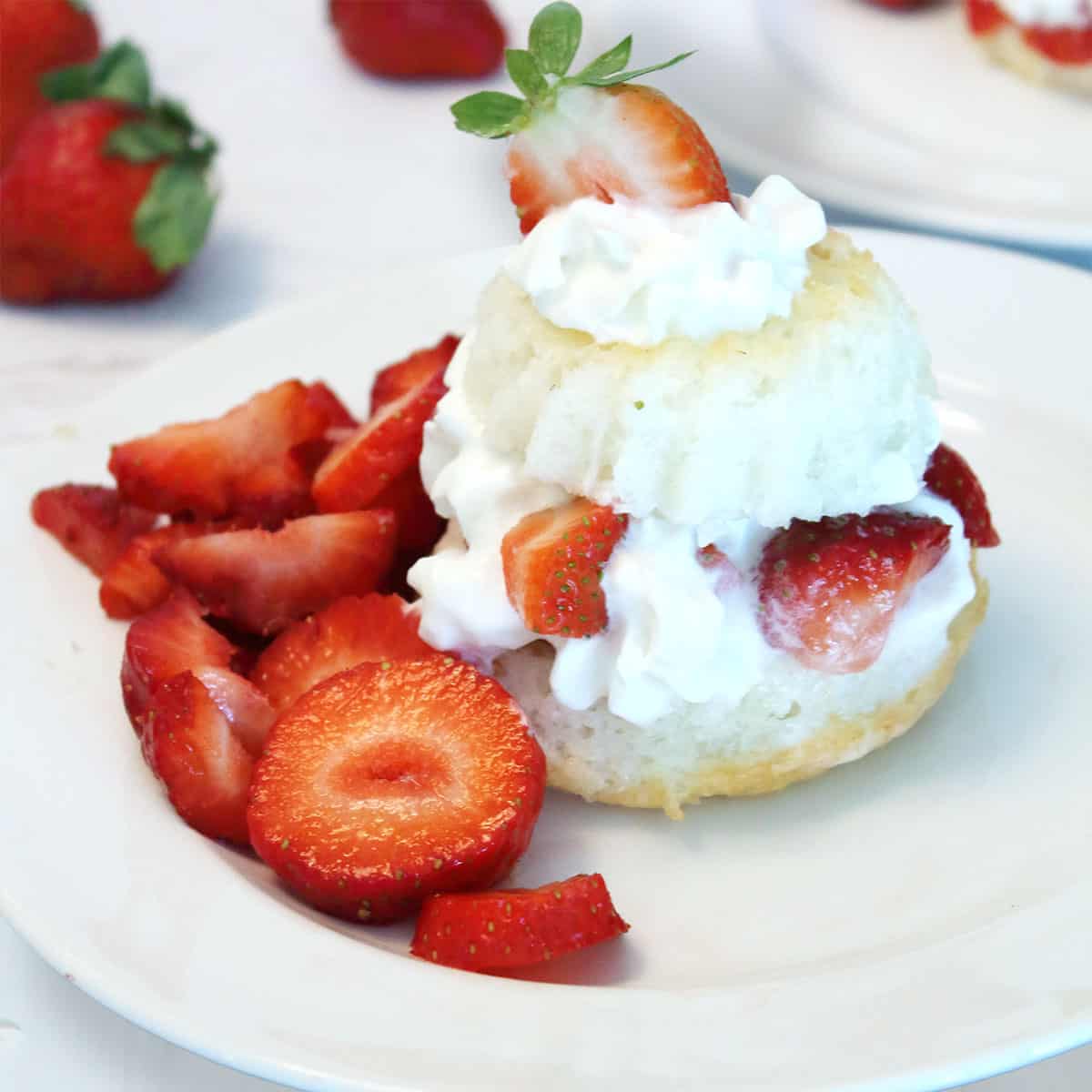 Closeup of plated strawberry shortcake recipe from scratch.