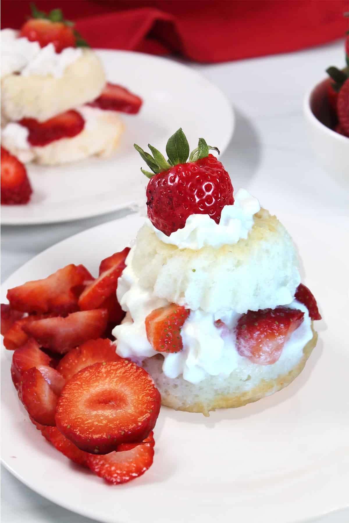 Strawberry shortcake with angel food cake filled with whipped cream and strawberries.