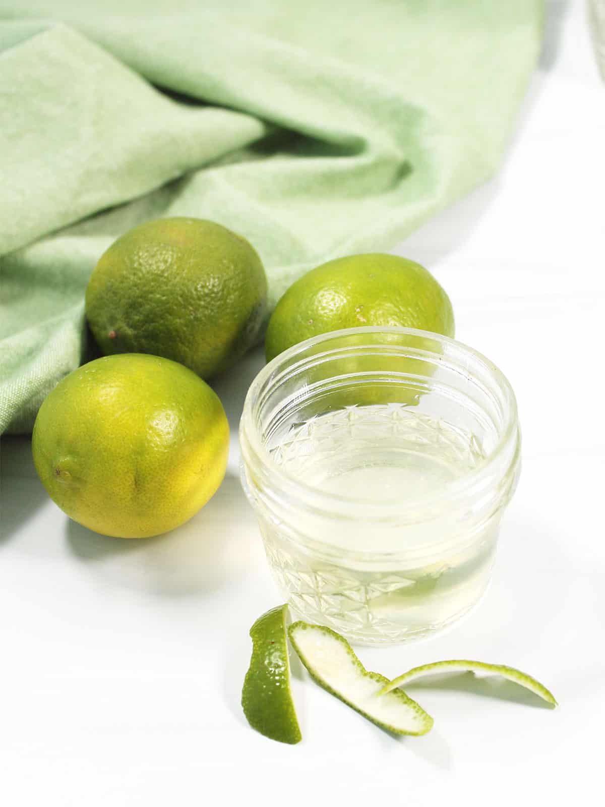 Lime simple syrup in a jar.