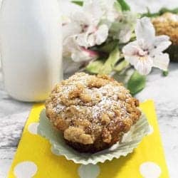 Banana Nut Muffins with Crumb Topping on top of polka dotted napkin.