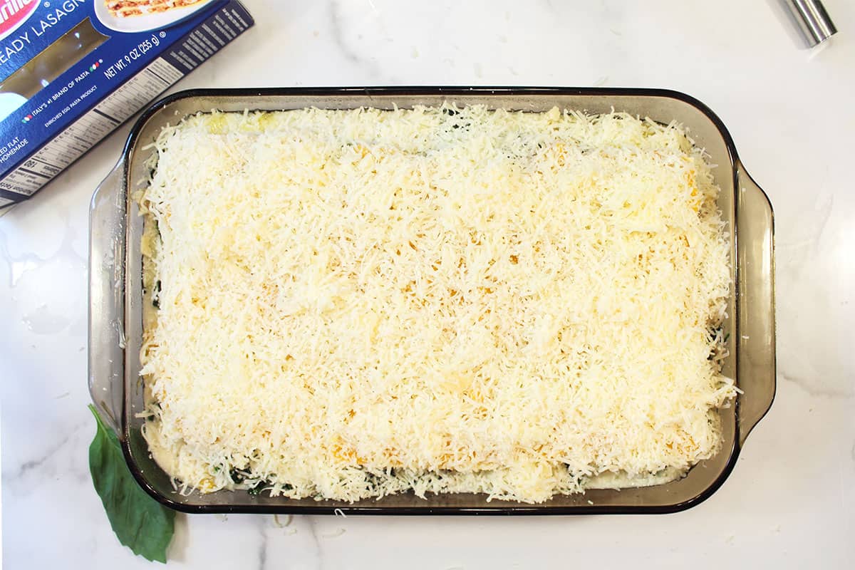 Covered with cheese and ready to bake.