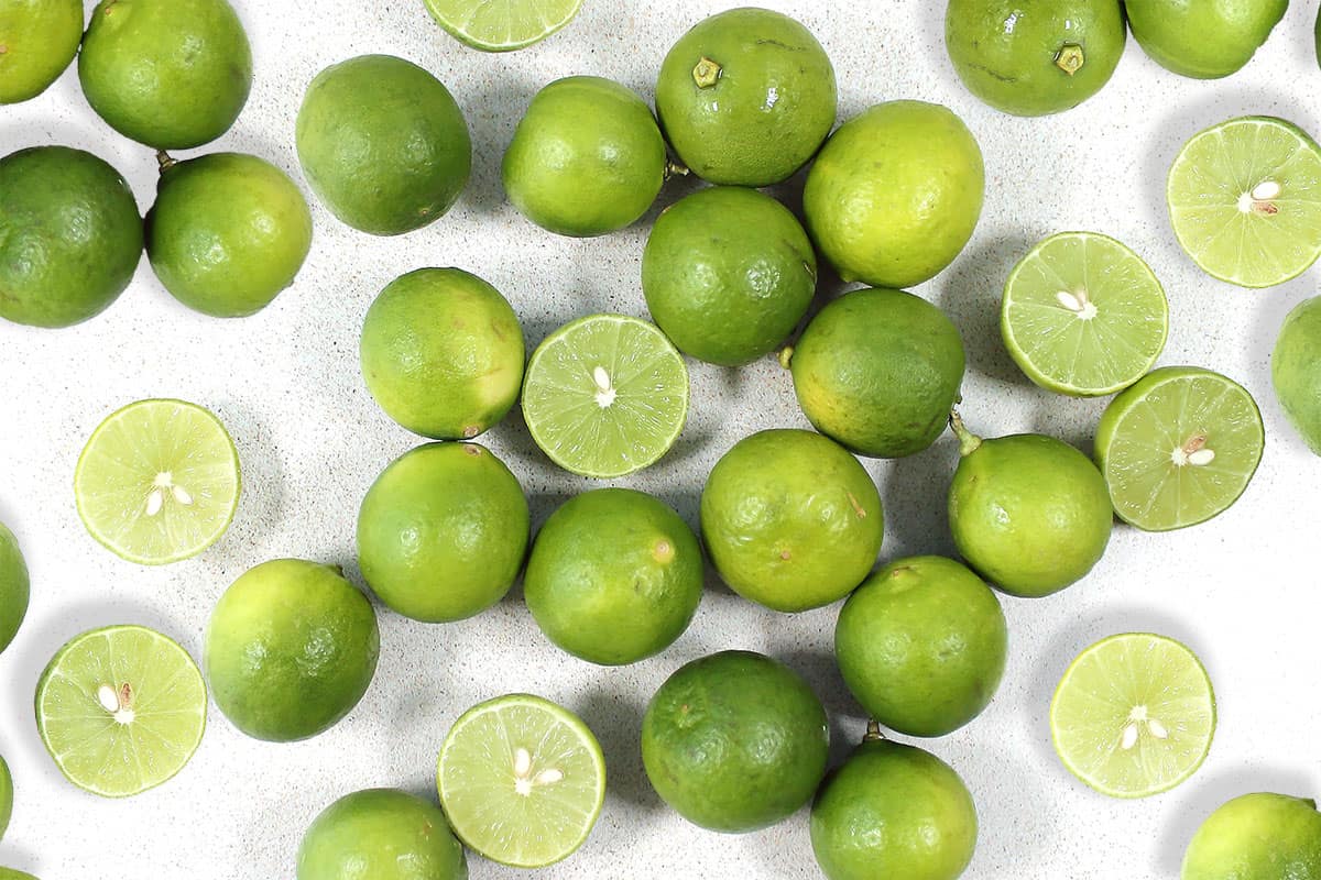 Scattered key limes on table.