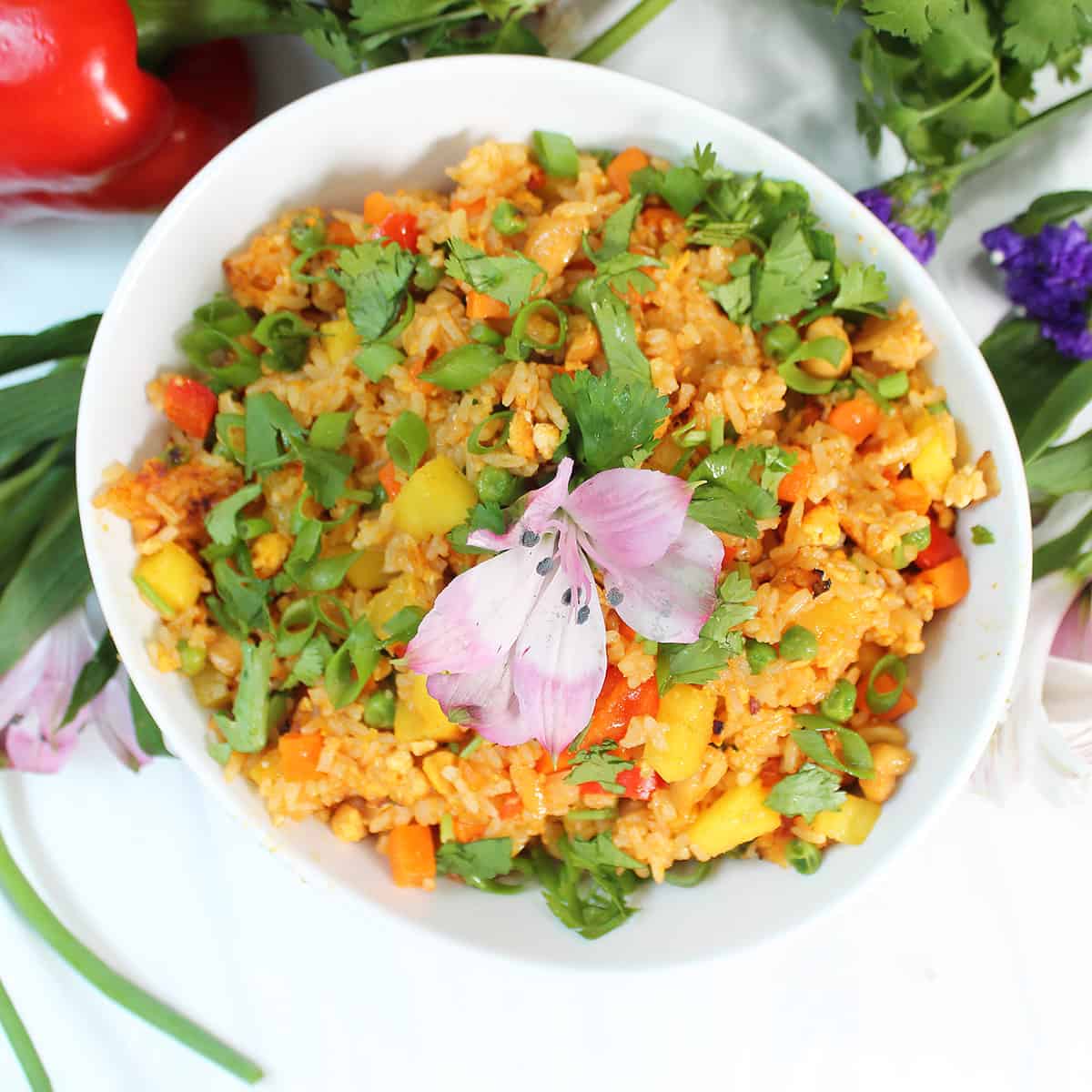 Overhead of bowl of fried rice with pineapple.