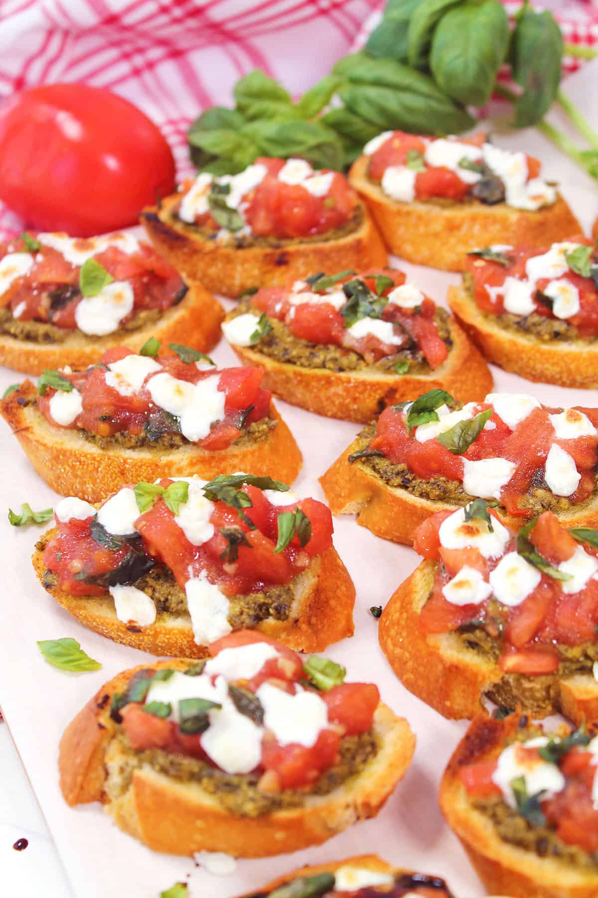 Finished bruschetta with basil garnish.