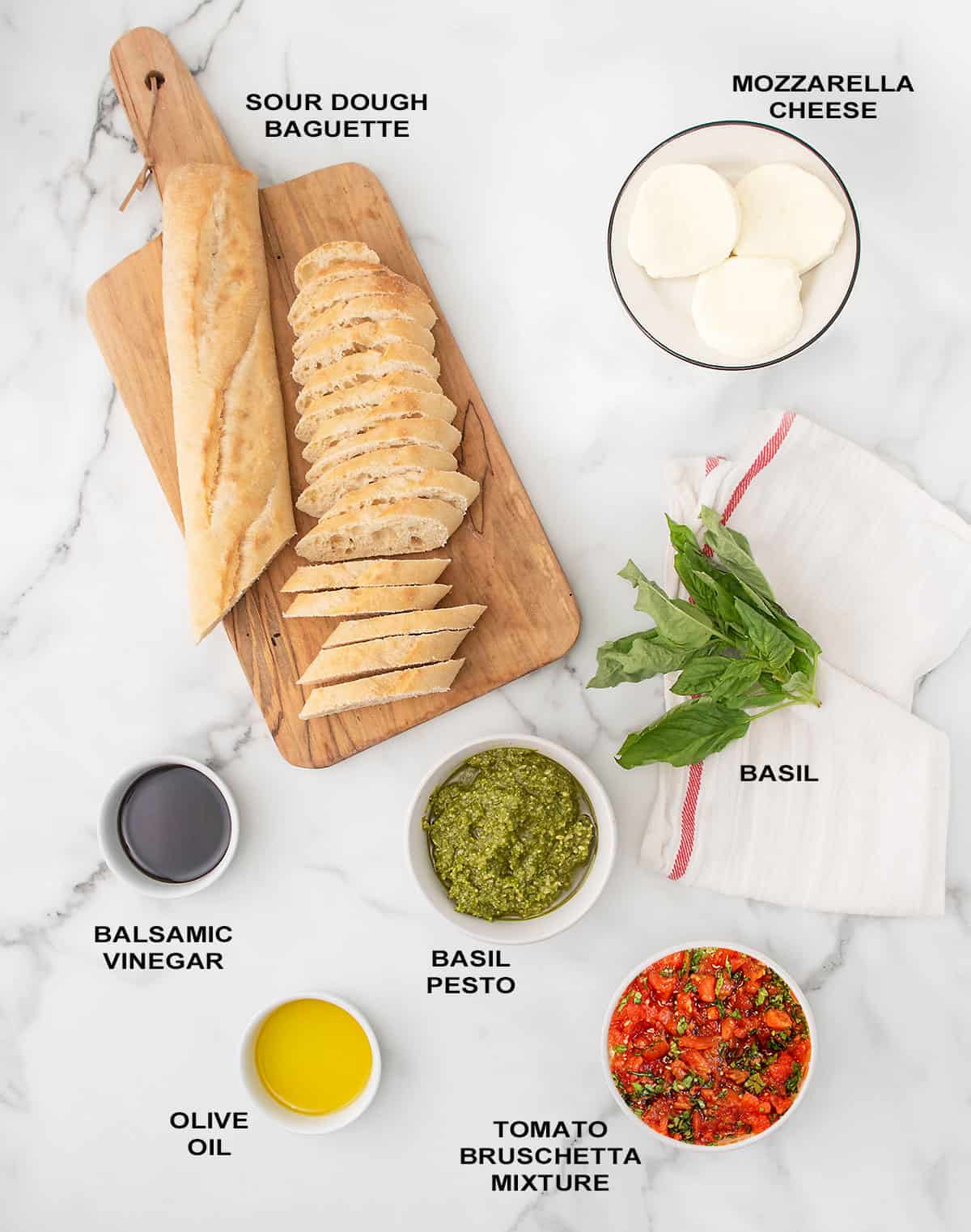 Ingredients for bruschetta with pesto and mozzarella.