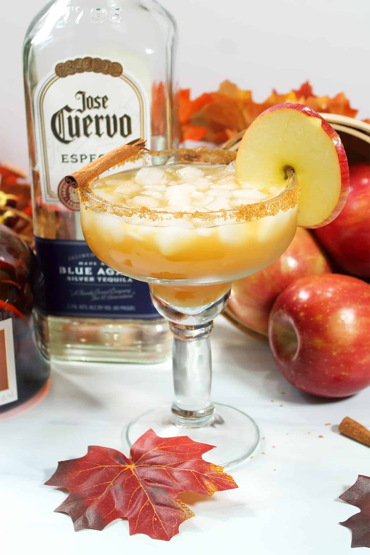 Apple Cider Margarita with tequila, apples and fall leaves.