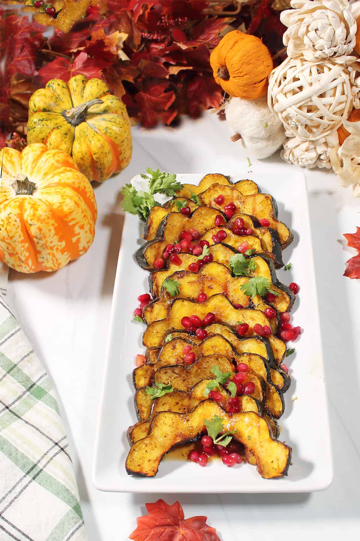 Garnished grilled squash on fall table.