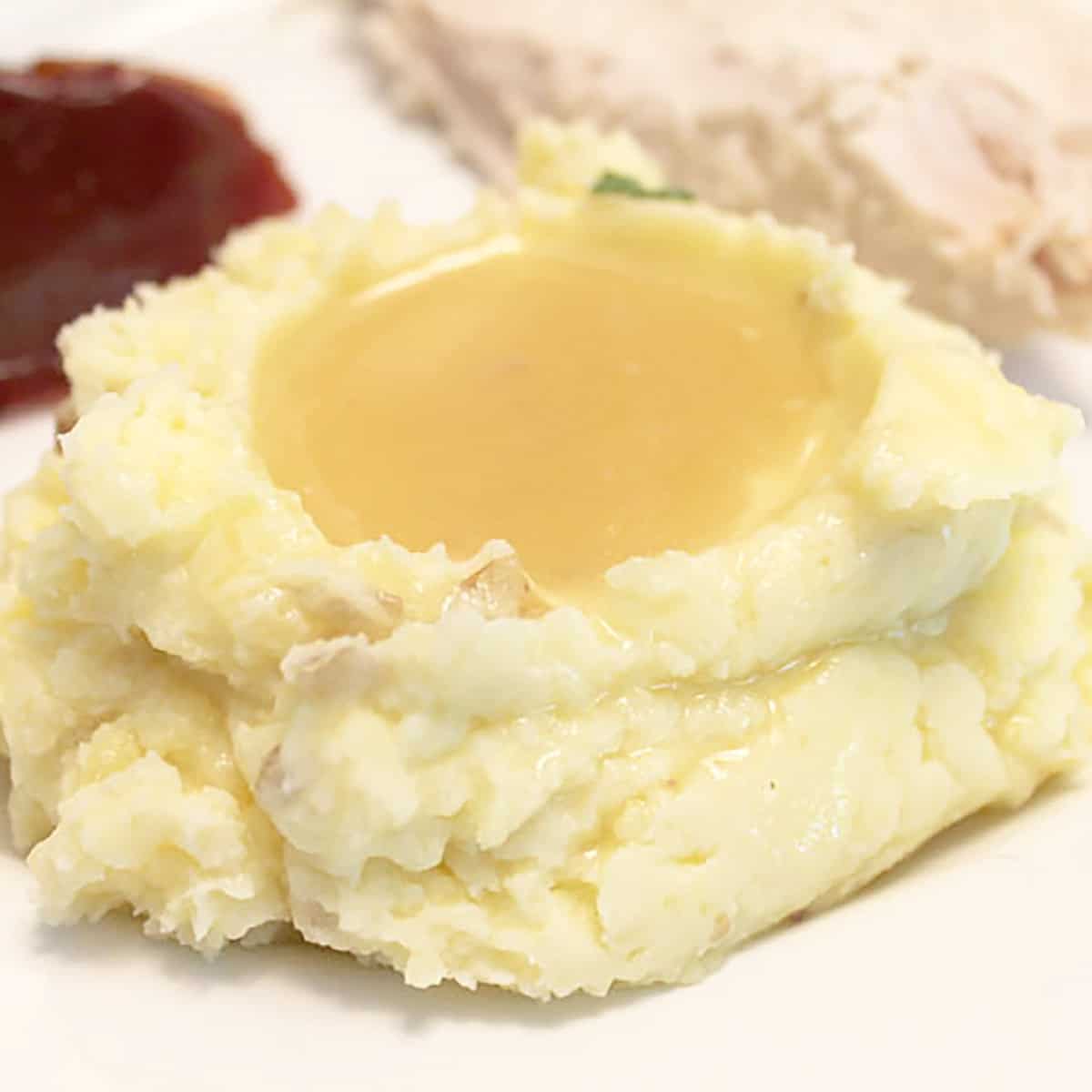 Mashed potatoes with gravy.