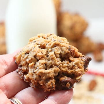 Holding cookie in hand.