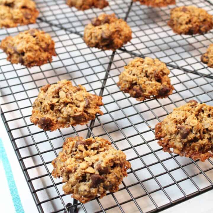 Gluten-free oatmeal cookies cooking on wire rack.