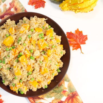 Overhead of partial bowl of pilaf on fall towel.