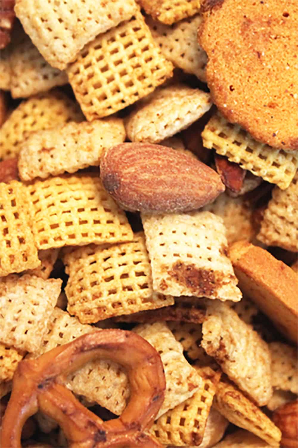 Snack mix closeup on cookie sheet.