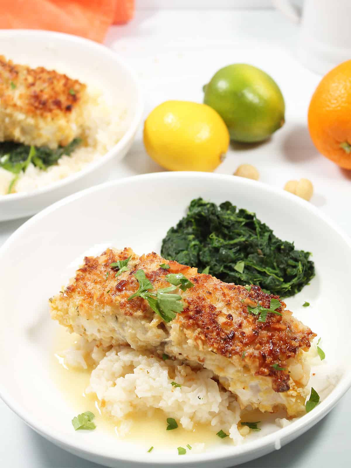 Macadamia Crusted Grouper plated over rice.