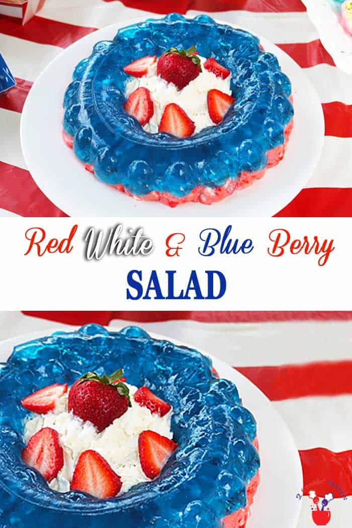 A fresh, colorful Red White and Blue Berry Salad that's perfect for any picnic or patriotic event. Strawberries, marshmallows and cream cheese make a rich bottom layer, topped with blueberry jello and a center filled with luscious whipped cream. #salad #jellosalad #patriotic #strawberries #blueberries #independenceDay