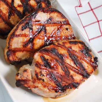 Grilled Honey Garlic Glazed Pork Chops on platter.