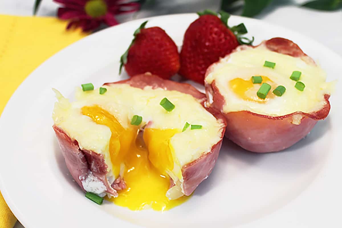 Inside of baked ham and egg cup showing liquid yolk.