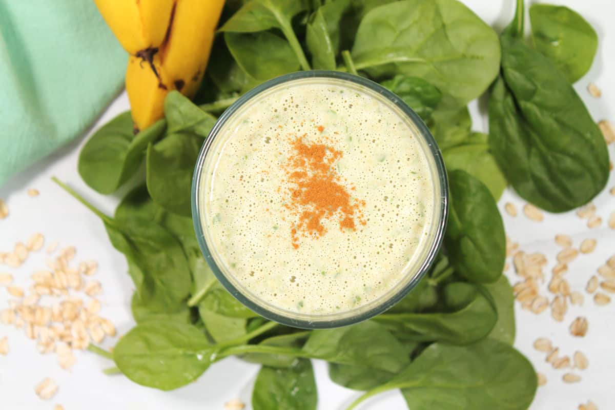 Overhead of banana smoothie with spinach.