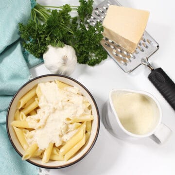 Asiago cream sauce in pitcher and poured over pasta.