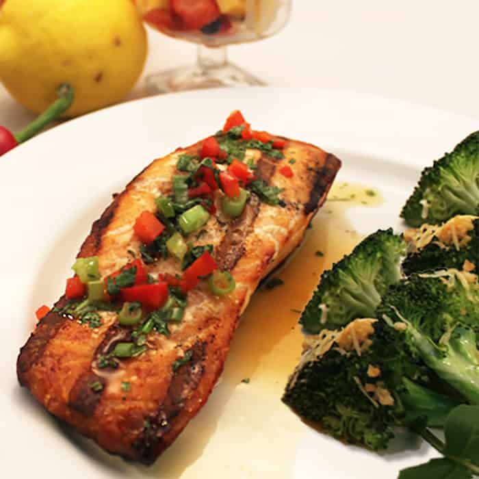 Grilled Salmon with Spicy Orange Sauce close up.