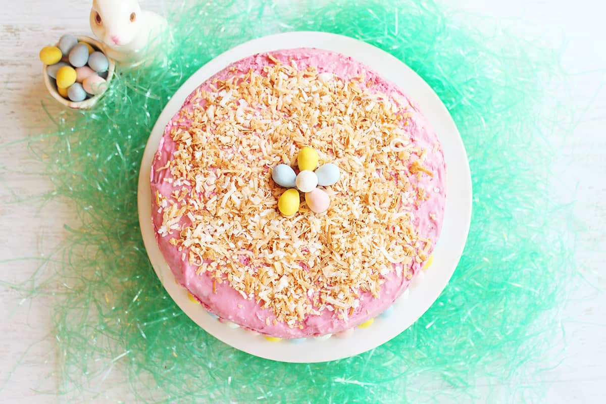 Overhead of frosted decorated key lime cake.