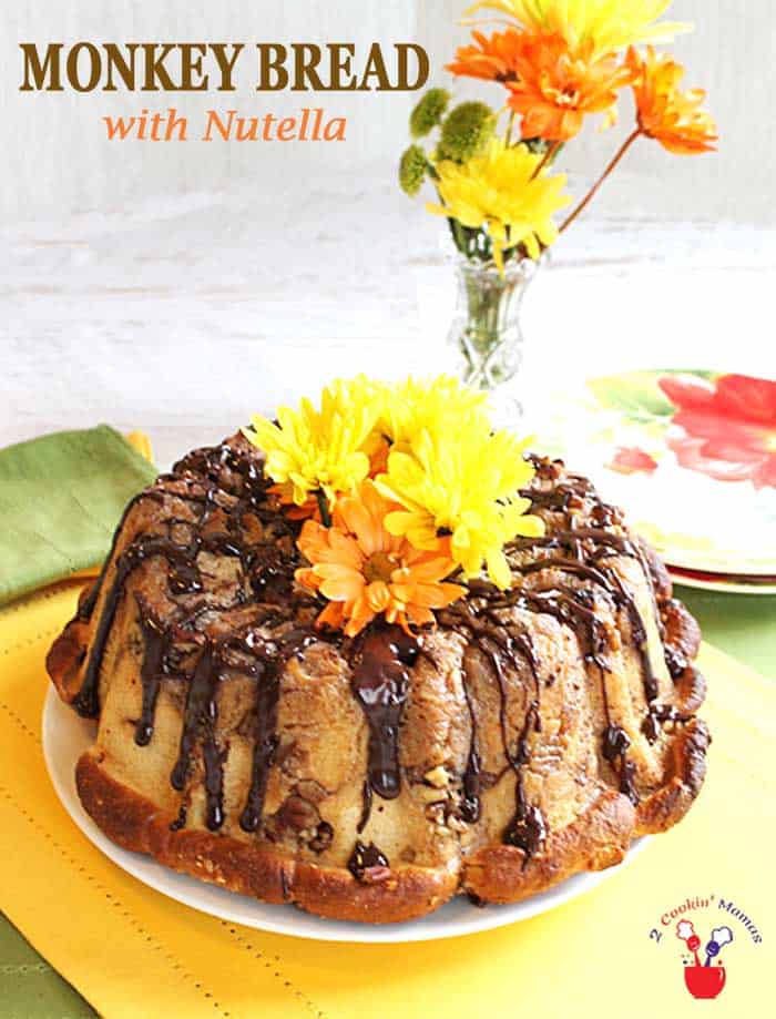 Monkey bread with Nutella is fun to make and even more fun to eat. Little sweet balls of dough, stuffed with Nutella, and covered in caramel glaze that easily pull off so you can pop them right into your mouth. #monkeybread #bread #breakfast #mothersday #caramel #Nutella #recipe