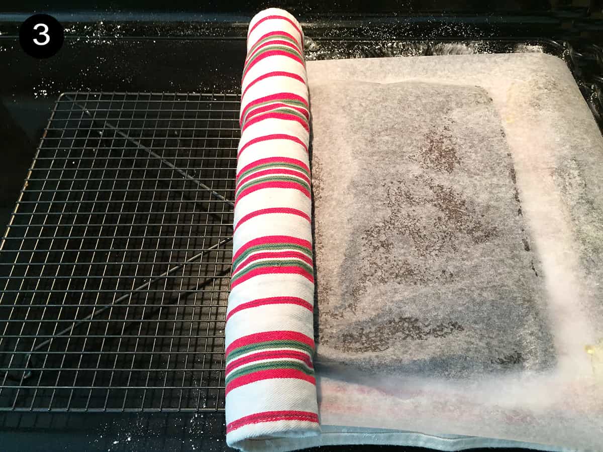 Rolling cake in sugar coated towel step 3.