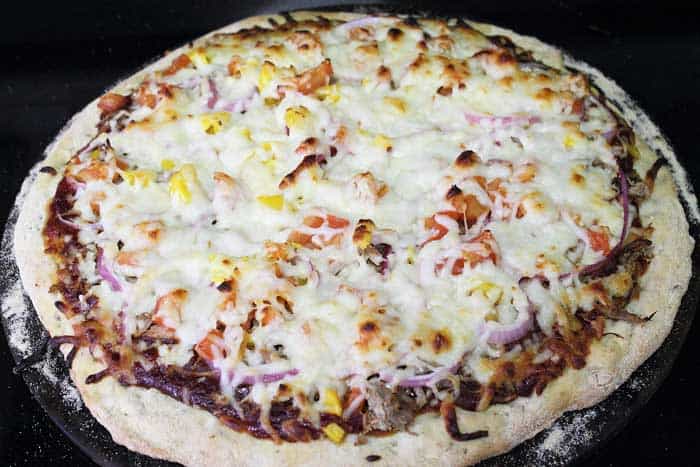 BBQ Pulled Pork Pizza baking in oven