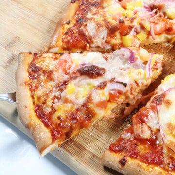 Closeup of BBQ pizza slice.