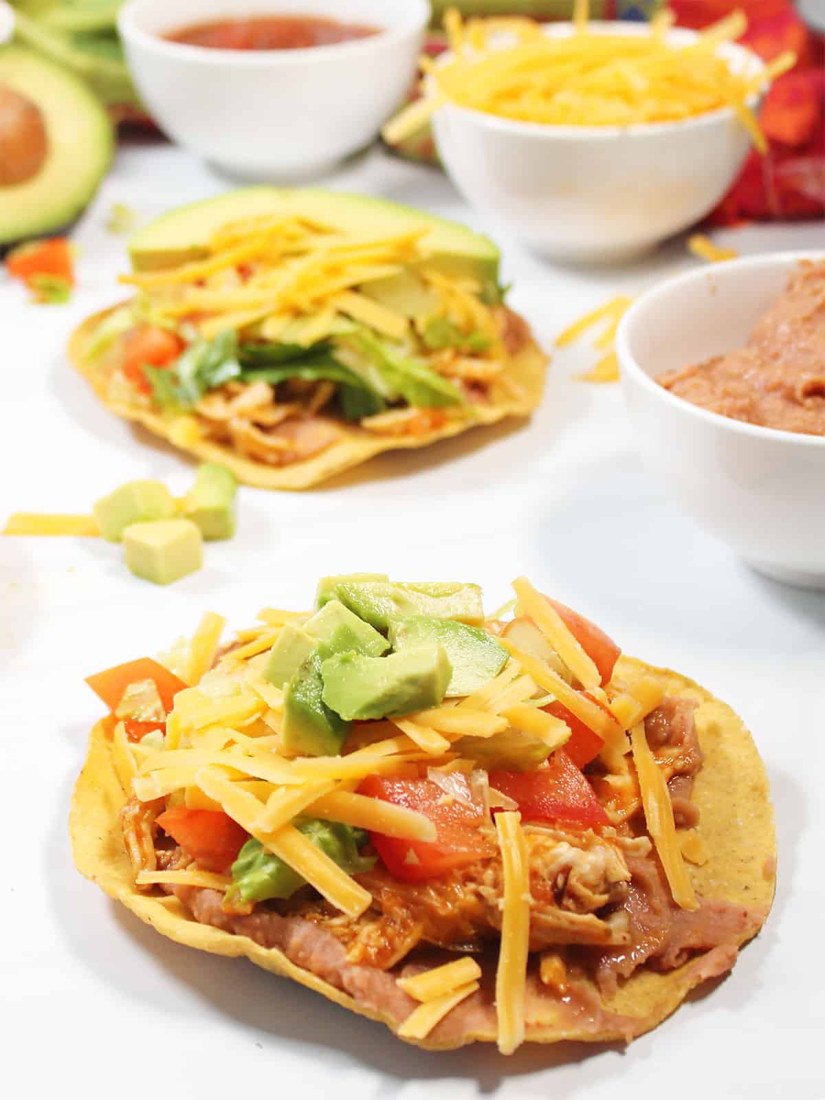 Closeup of Chicken Tinga Tostadas with all the toppings.