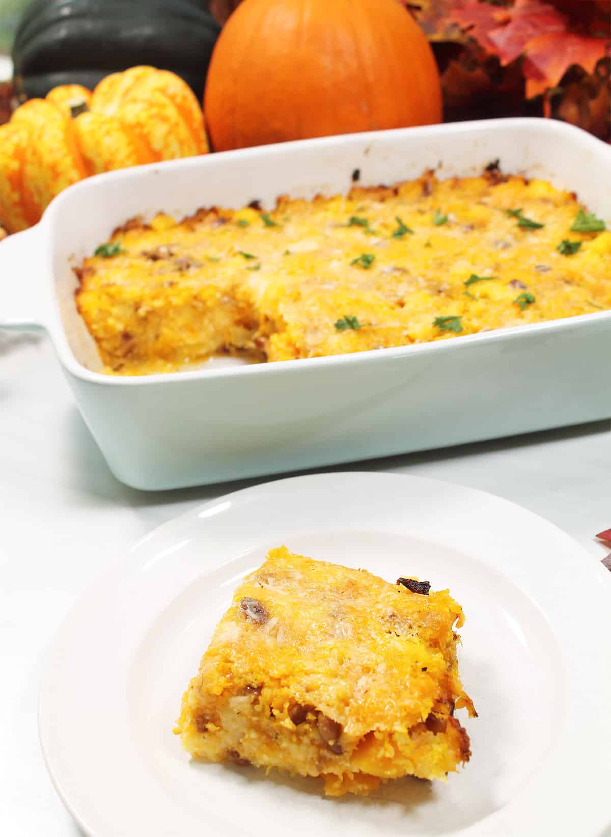 Butternut Squash and Polenta casserole with slice in front.