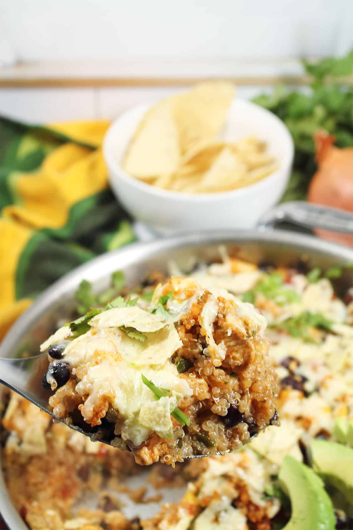 Spoonful of Mexican quinoa casserole.