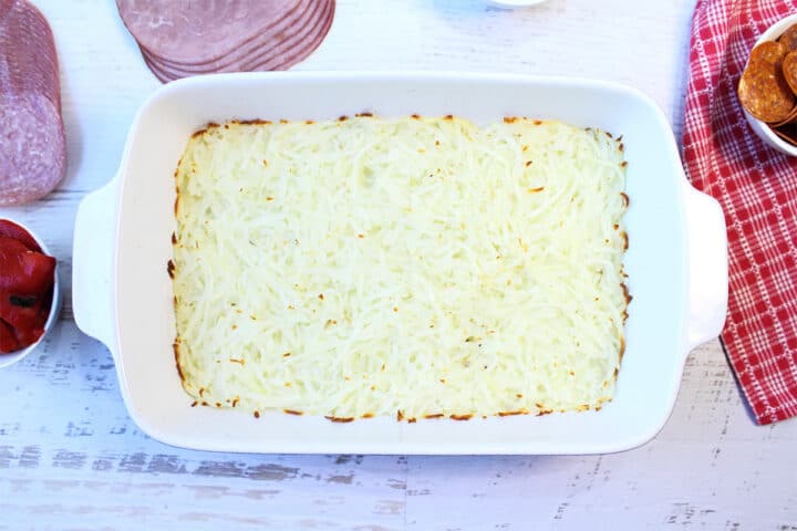 Bottom layer of hash browns baked.
