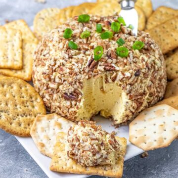 Mango Chutney Cheese Ball spread on cracker.