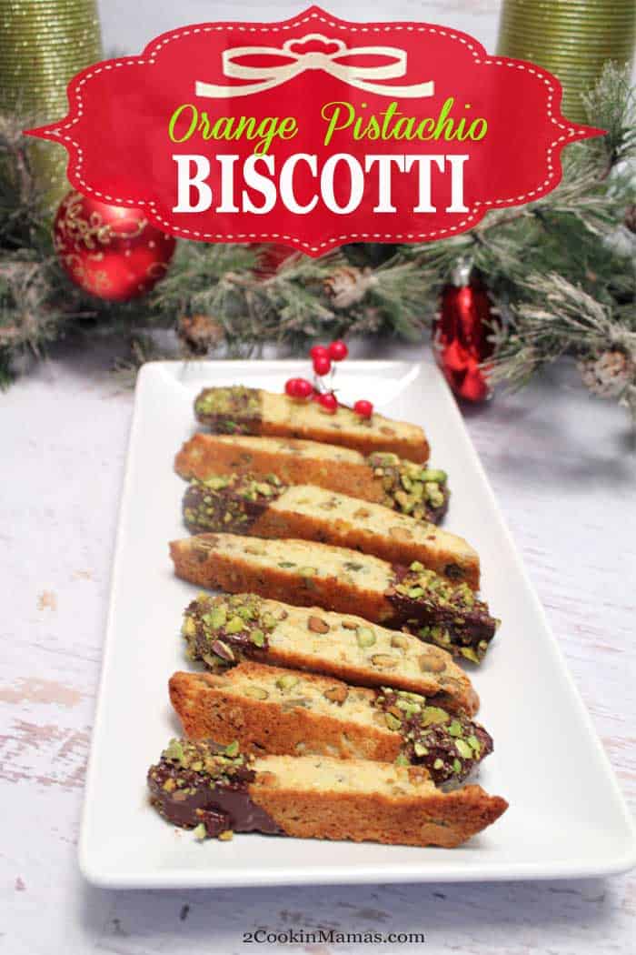 Orange Pistachio Biscotti | 2 Cookin Mamas A delicious orange pistachio biscotti, flavored with orange, filled with plenty of pistachios then dipped into dark chocolate! Easy to make & easier to eat! #biscotti #cookies #holidaybaking #recipe #pistachio #chocolate