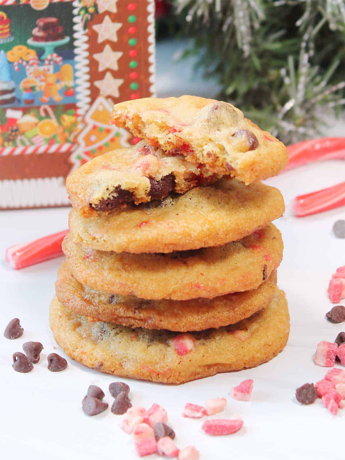 A stack of cookies with halved one on top.