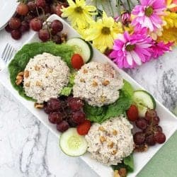 Chicken Salad with Grapes on platter overhead with flowers.