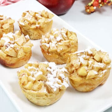 Apple French Toast Muffins with powdered sugar.