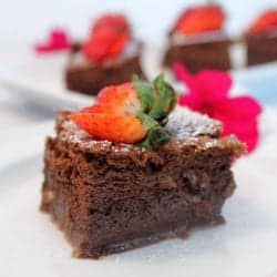 Chocolate magic cake with strawberry garnish.