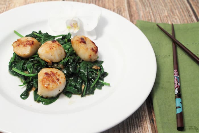 Seared Sea Scallops over Garlic Spinach plated | 2 Cookin' Mamas