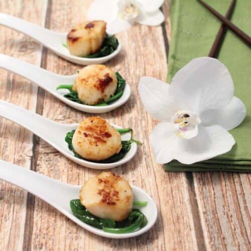 Seared Sea Scallops over Garlic Spinach