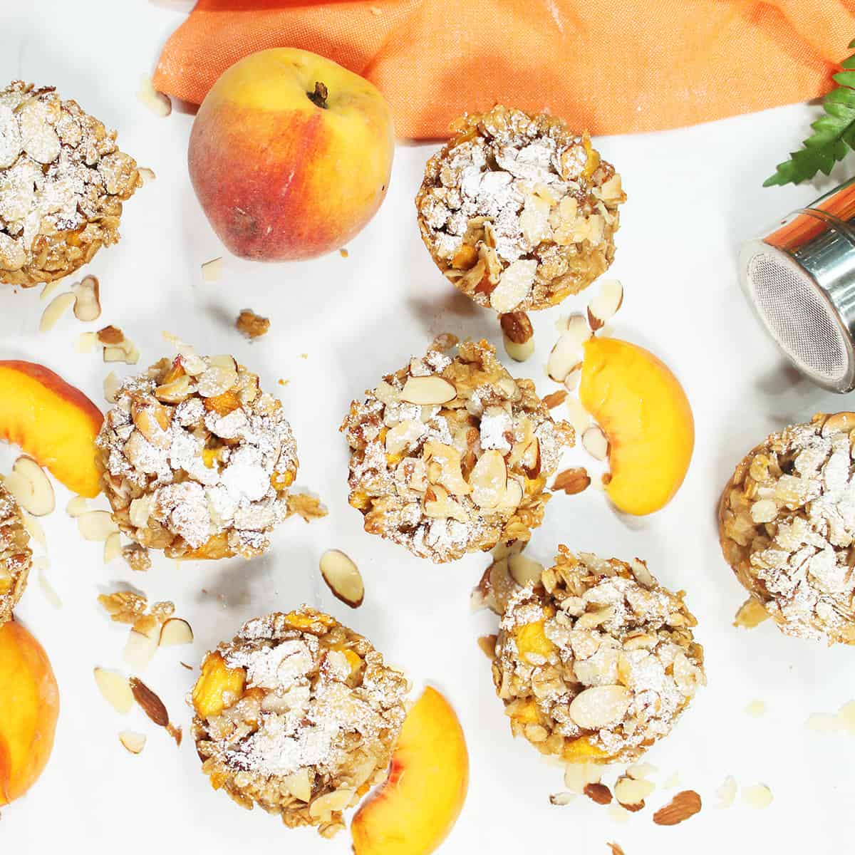 Overhead of sugar coated muffins with peach.