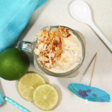 Overhead of pineapple coconut smoothie with toasted coconut.