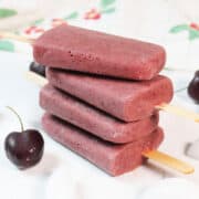 Stacked cherry chocolate smoothie popsicles.