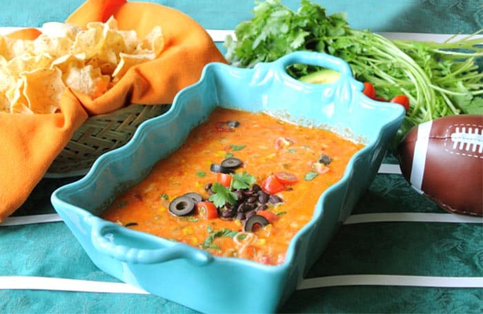 Spicy Mexican Cheese Dip next to a football