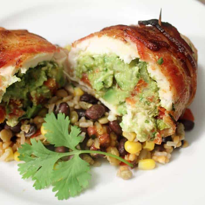 Closeup of guacamole stuffing on top of lentil vegetables.