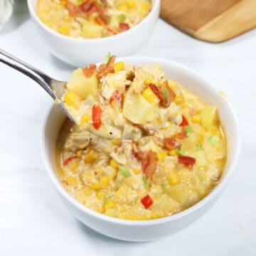 Chicken and Corn Chowder spoonful over bowl.