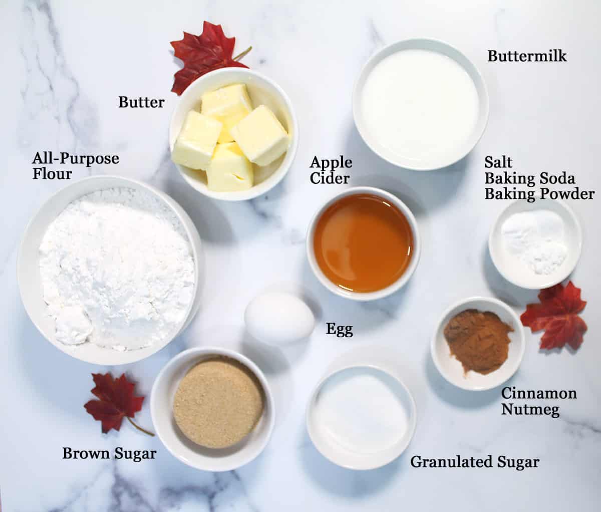 Ingredients for apple cookies on white table.