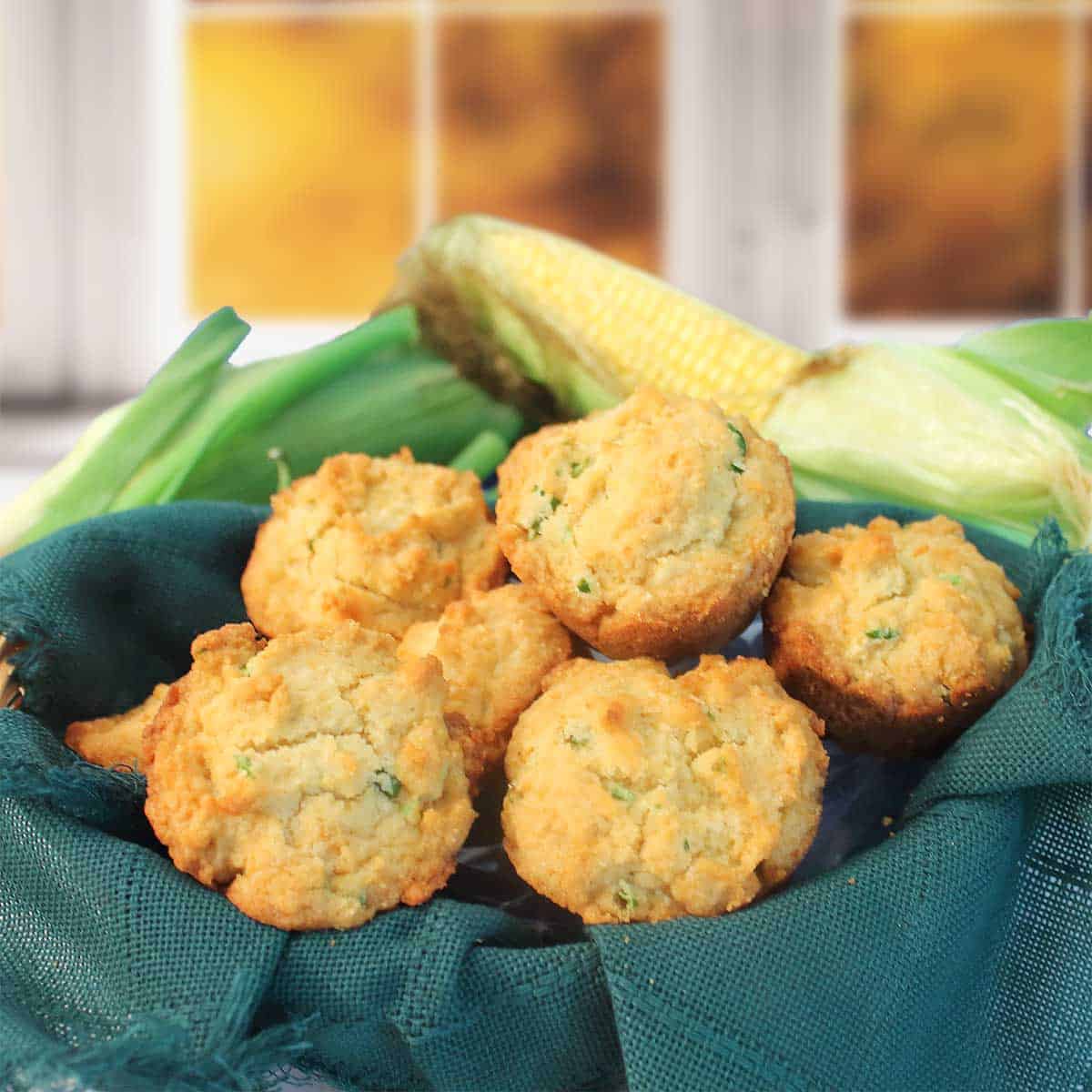 Cornbread jalapeno muffins in a basket.