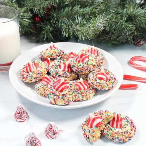 Plated white chocolate peppermint kiss cookies with milk.